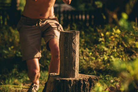 A guy chopping woodの写真素材