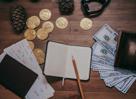 bitcoin with cash on the wood table