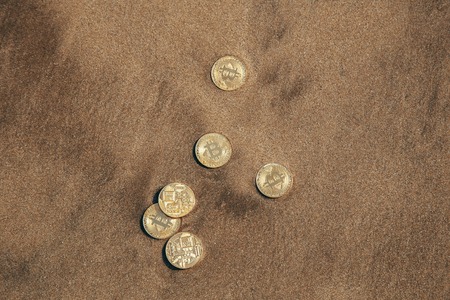 bitcoin on the sand by the seaの写真素材