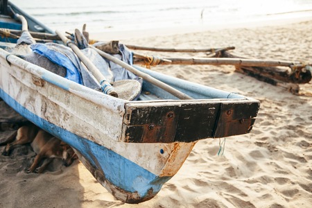 fishing boat on the seashore at summer dayの写真素材