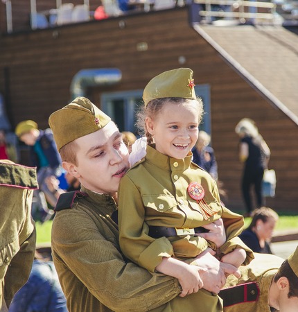 Russian military soldier are holding a girl at 9 may 2018 in Moscow Victory Parkのeditorial素材