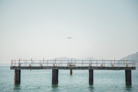 the plane is landing to the airport of Corfu at summer dayの写真素材