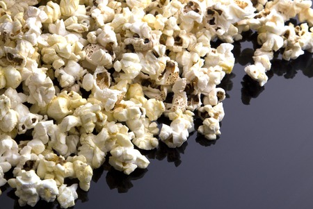 Popcorn texture  on dark tableの写真素材
