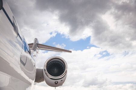 Modern and comfortable business jet plane in the afternoon at the airport