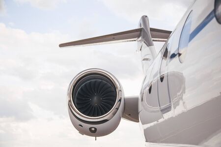Modern and comfortable business jet plane in the afternoon at the airport