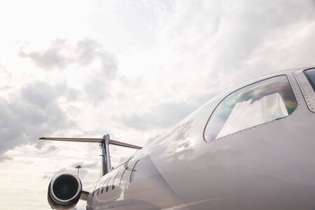 Modern and comfortable business jet plane in the afternoon at the airportの写真素材