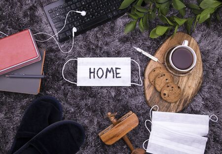 creative home work space - work from home concept in coronavirus quarantine with mediccal protection maskの写真素材