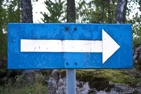 Blue Road Sign With Arrowの写真素材