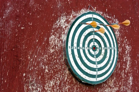 Dart hitting a target on redの写真素材