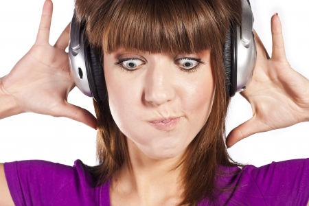 Pretty woman listening, and enjoying musicの写真素材