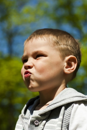 Close up portrait of a beautiful kid outdoorの写真素材