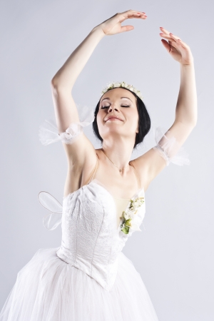 Beautiful ballerina posing on greyの写真素材