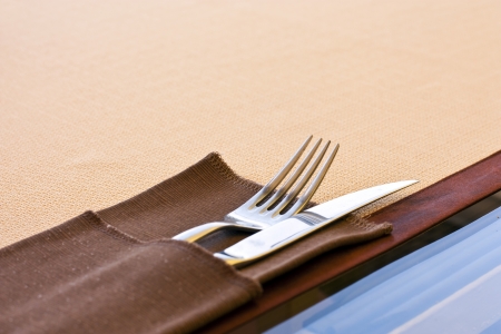 Place setting - plate, knife and fork on tableの写真素材