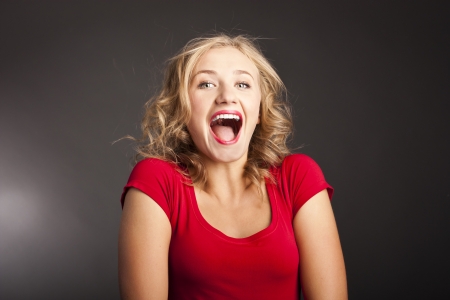 Very positive blonde in the studio. laughter emotionsの写真素材