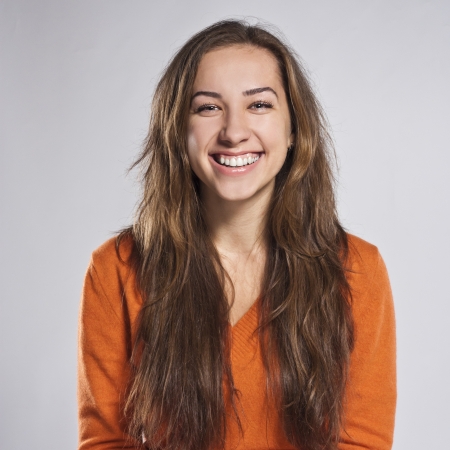 Portrait of a young student in the studio positiveの写真素材