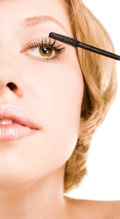 woman paints eyelashes. studioの写真素材