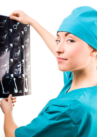 Doctor Woman watches the X-ray. isolatedの写真素材