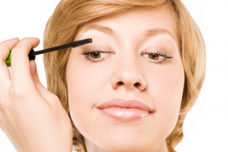 woman paints eyelashes.の写真素材