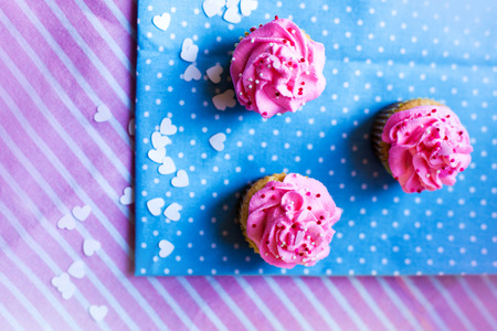 cute cupcakes with pink creamの写真素材