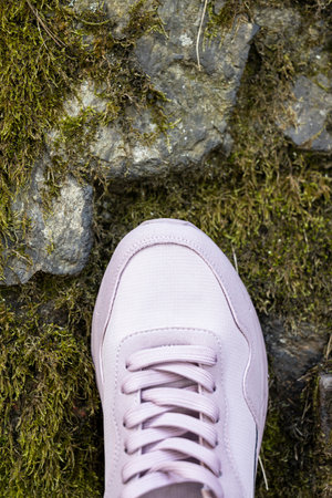 Lacing of light pink textile sneakers with. close-upの写真素材