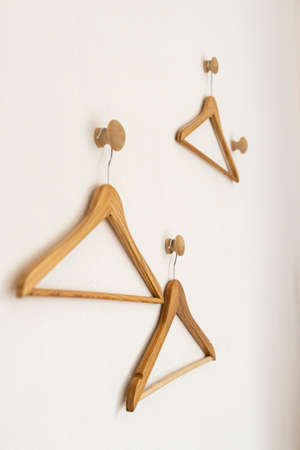 empty wood clothes hanger on wallの写真素材