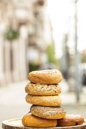 Different types of bagels in a stack
