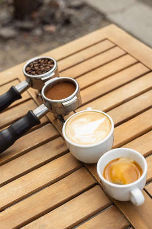 different black coffee on wood backgroundの写真素材