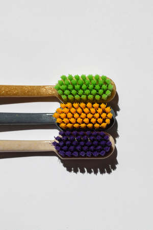 three different toothbrushes made from recycled plastic. eco productの写真素材