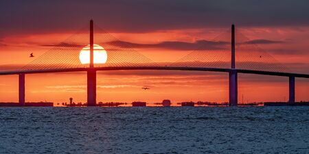 Bridge with the sun rising behind itの写真素材