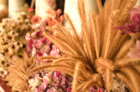 closeup colorful Fake flower in the vase, retro styleの写真素材