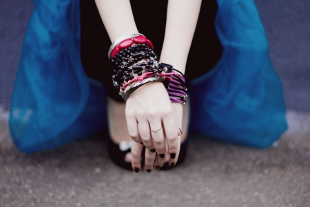Arms with bracelets and ring