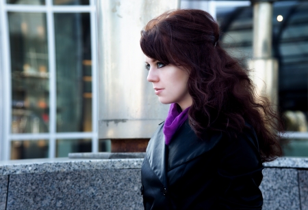 Beauty portrait of young woman with black eyeliner on urban backgroundの写真素材