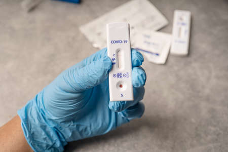 Man holding Corona Covid-19 Rapid Antigen Test ,Antibody Test with negative result