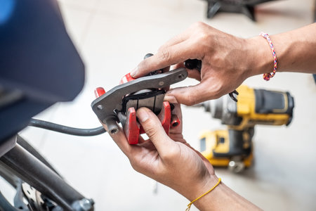 Mechanic replace motorcycle Brake system, Change Motorcycle Brake Pads at garage. maintenance,repair motorcycle concept .の写真素材