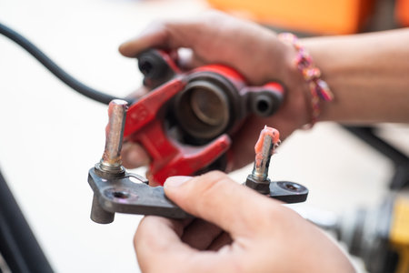 mechanic use Rubber grease for lubricating caliper pin or Disc brake caliper on motorcycle at...
