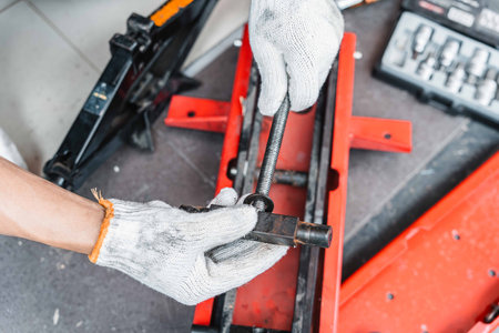 Mechanic Man repair scissors jack or motorcycle lift tables in garage,  scissor jack threads were...