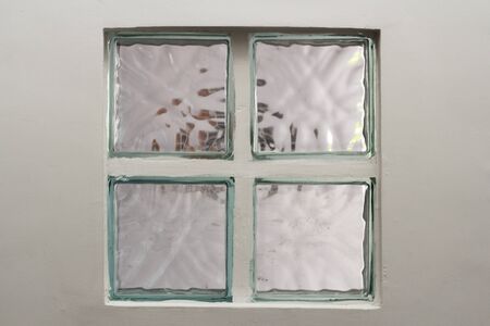taking pictures in the morning to allow light to pass through the glass bricks.abstract background of glass blocks for design.The glass window passes through the house.の写真素材