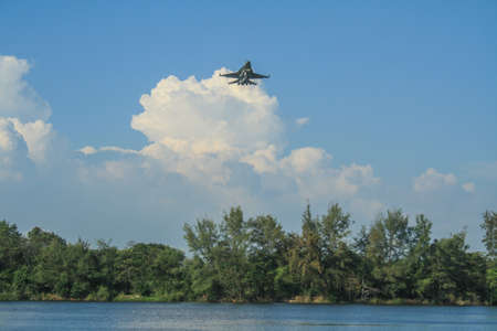 Rayong/Thailand- âNovember â21, â2018:  F-16 over the tree at U-Tapao Rayong International Airport, Rayong,Thailandのeditorial素材