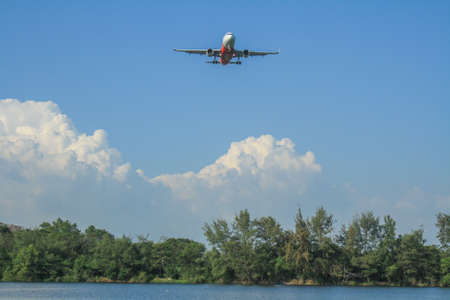 Rayong/Thailand- âNovember â21, â2018: Blurred Photography of Air Asia Airline flying over the tree at U-Tapao Rayong International Airport, Rayong,Thailandのeditorial素材