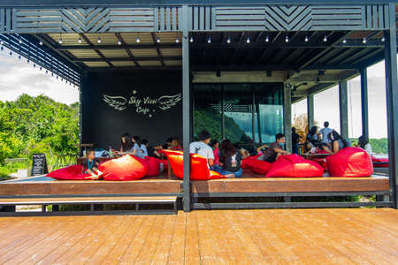 Sky view cafe, Chanthaburi, Thailand. May 31, 2020 : Bright atmosphere, Tourists sitting happily at viewpoint of sky view cafe, Pha Sukniran View Point, Chanthaburiのeditorial素材