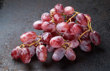 red grapes , fresh with water dropsの写真素材