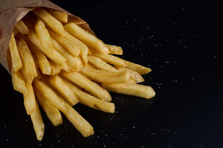 french fries on black backgroundの写真素材