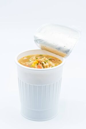 Boiled noodle in a plastic cup on a white backgroundの写真素材