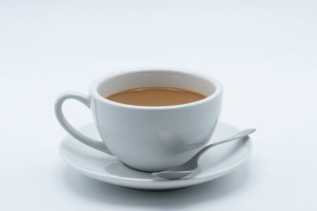 Latte coffee in a ceramic cup on a white backgroundの写真素材