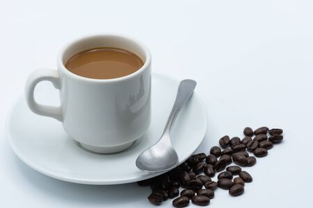 Milk coffee in a ceramic cup on a white backgroundの写真素材