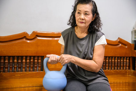 Grandma enjoys exercising in the parkの写真素材