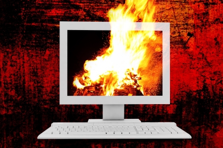 fire burning in the monitor on an abstract backgroundの写真素材