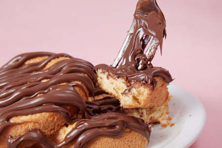 fresh pancake in a plate poured with chocolate paste, cream on buns, pancakes with chocolate