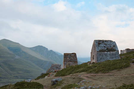 mountain landscape, stone crypts on the mountainside, dolmens, ancient burials, ancestral cemeteryの写真素材