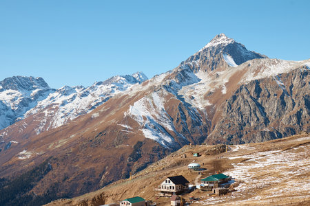 A house in the mountains, a village on a slope, snow cliffs, life in the mountains, a house on top of a mountainの写真素材